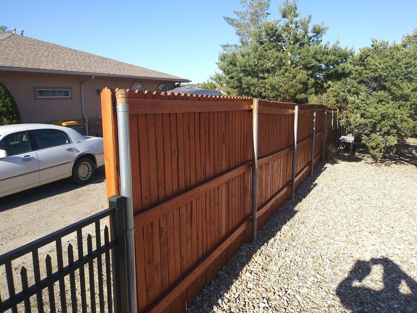 Stained fence and exterior woodwork by Aragon's PRO Painting