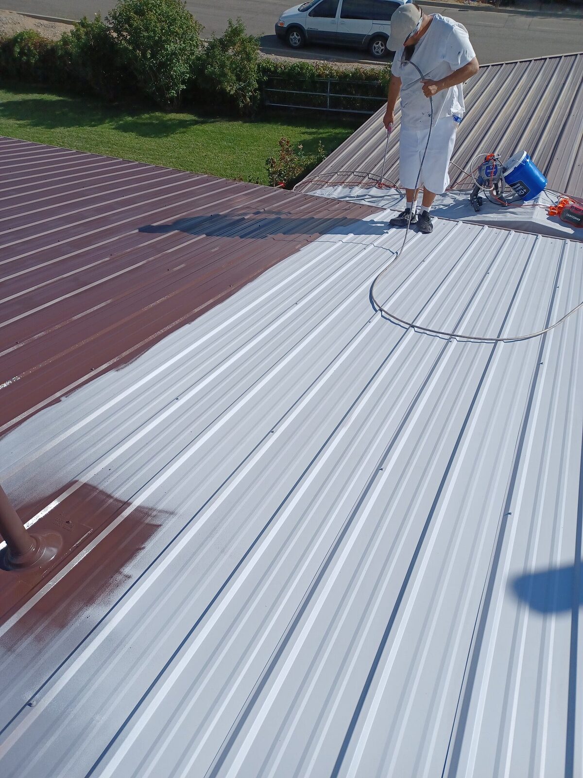 Metal roof coated and sealed by Aragon's PRO Painting